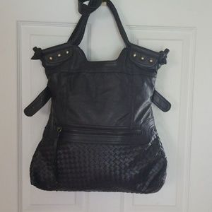 Beautifully styled handbag  with braided handles